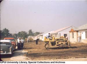 Men clearing yard spaces around their Flanner House homes (image IUPUI University Library Special Collections and Archives).
